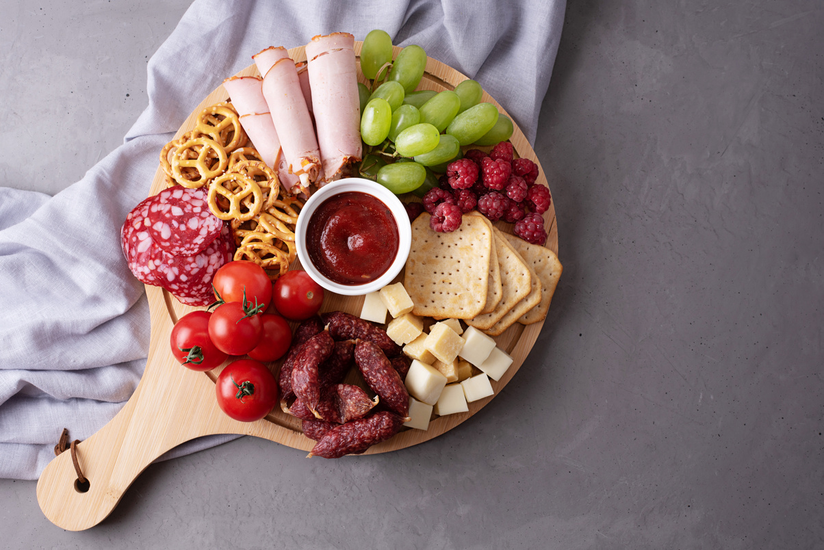 Charcuterie Board with Cold Cuts, Cheese, and Fruits